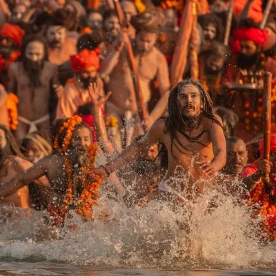 A Moment of Ecstasy and Liberation Naga Sadhus Rushing into the Holy Waters for the Auspicious Bath at the Kumbh Mela